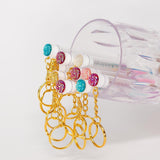 eyelash brush with gold keychain